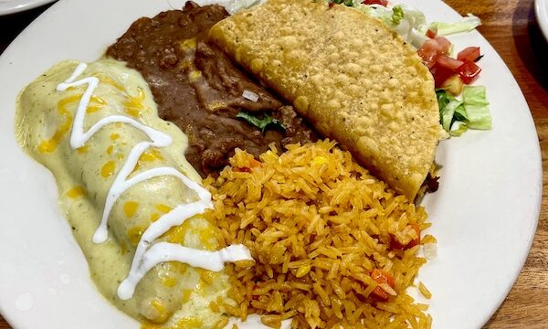 White plate topped with an enchilada, rice, beans and taco at Abuelo's Mexican Restaurant Midland TX