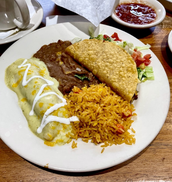 White plate topped with an enchilada, rice, beans and taco at Abuelo's Mexican Restaurant Midland TX