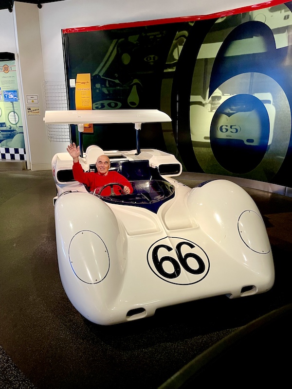 Steve, behind the wheel of a white race car at the Chaparral Gallery Petroleum Museum