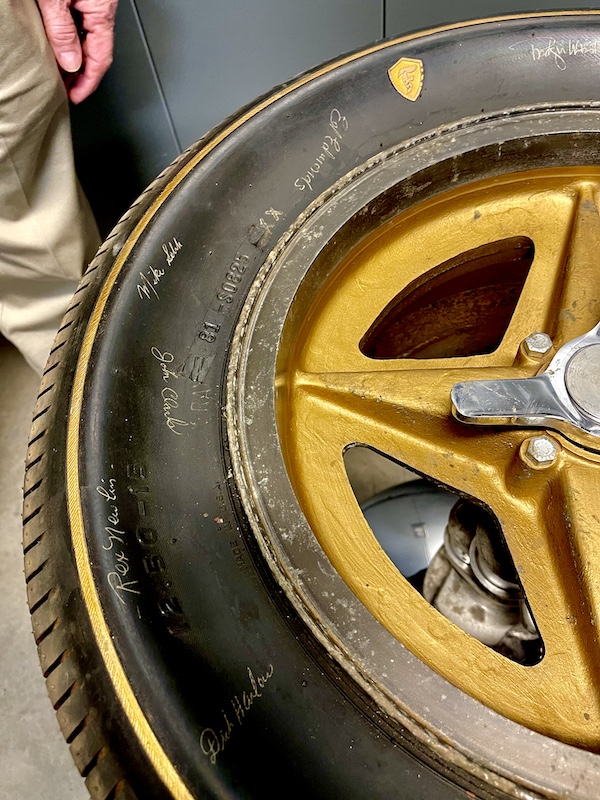 A Firestone tire with signatures of drivers on display as a table at the Chaparral Gallery Petroleum Museum