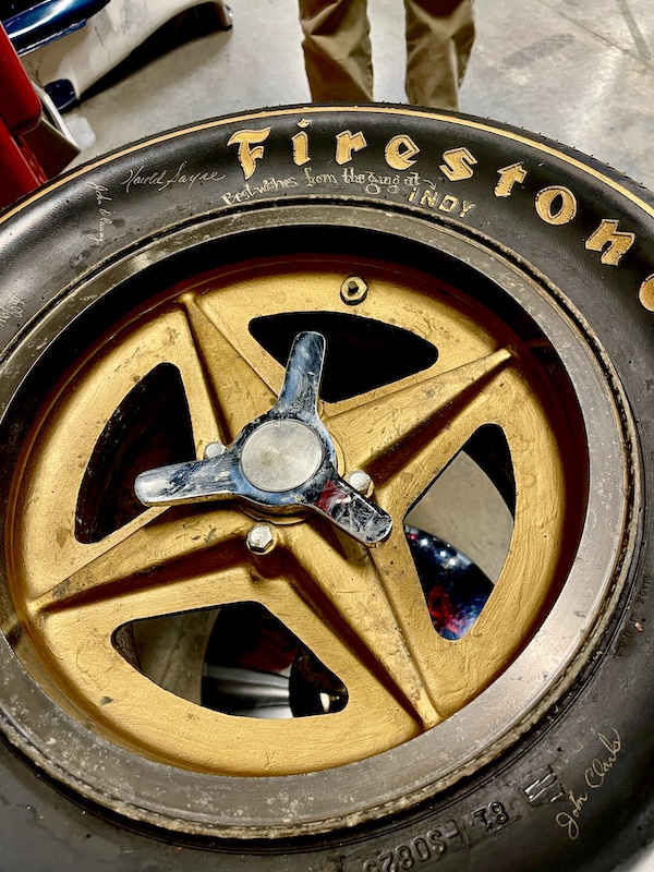 A Firestone Indy tire with signatures of drivers on display as a table at the Chaparral Gallery Petroleum Museum