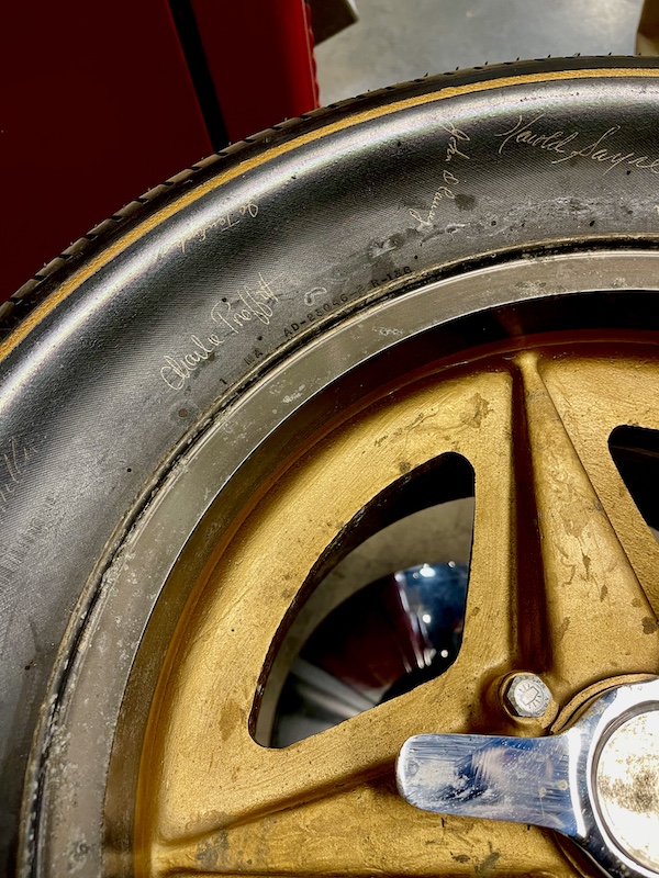 A Firestone tire with signatures of drivers on display as a table at the Chaparral Gallery Petroleum Museum