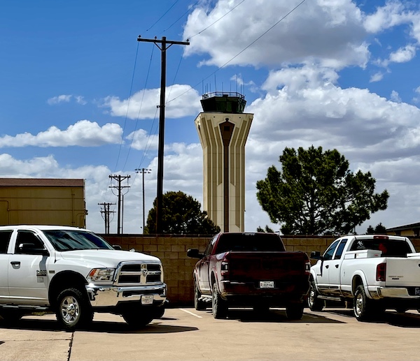 An air control tower and cars at Dyess Air Force Base Abilene TX