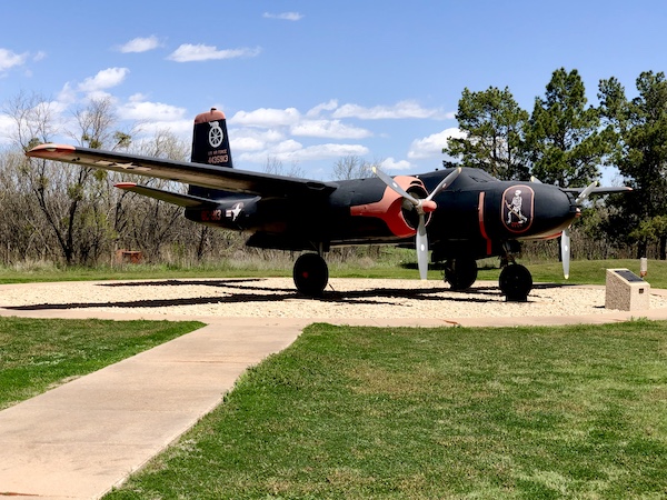 Black plane with skeleton painted on nose on display at Dyess Air Force Base Abilene TX