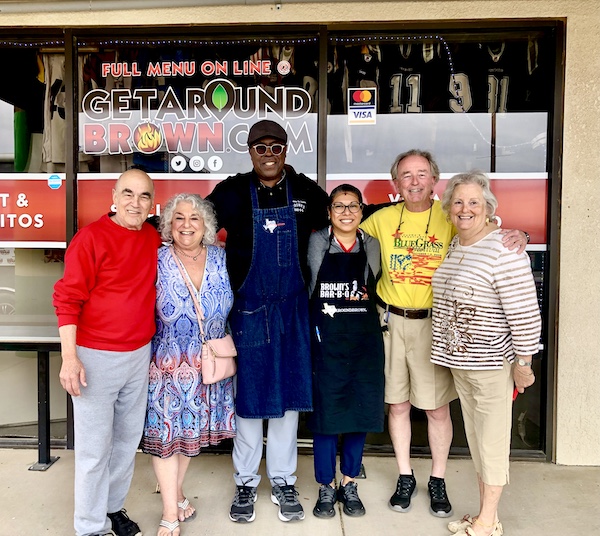 Our group of people posing in front of Get Around Brown BBQ Midland TX