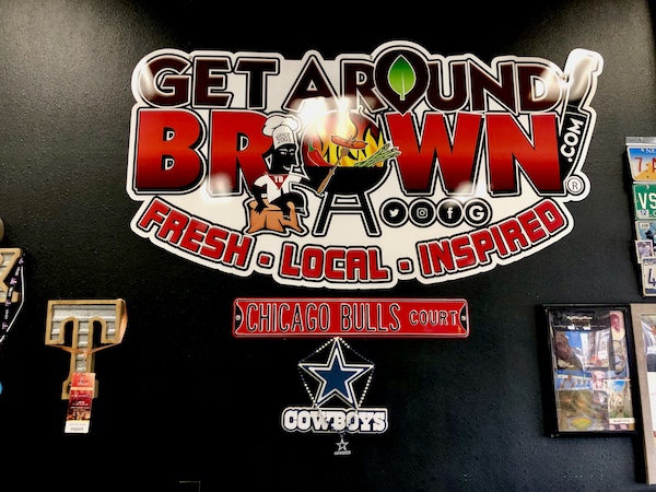 Sign at Get Around Brown BBQ Midland TX let's you know where you are.