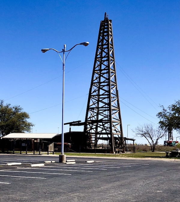 A wooden structure that's a 1923 oil rig on display at Petroleum Museum Midland Texas