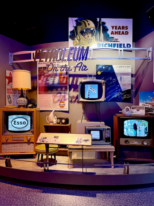 Old TVs on display showing ads for petroleum companies at the Petroleum Museum Midland Texas