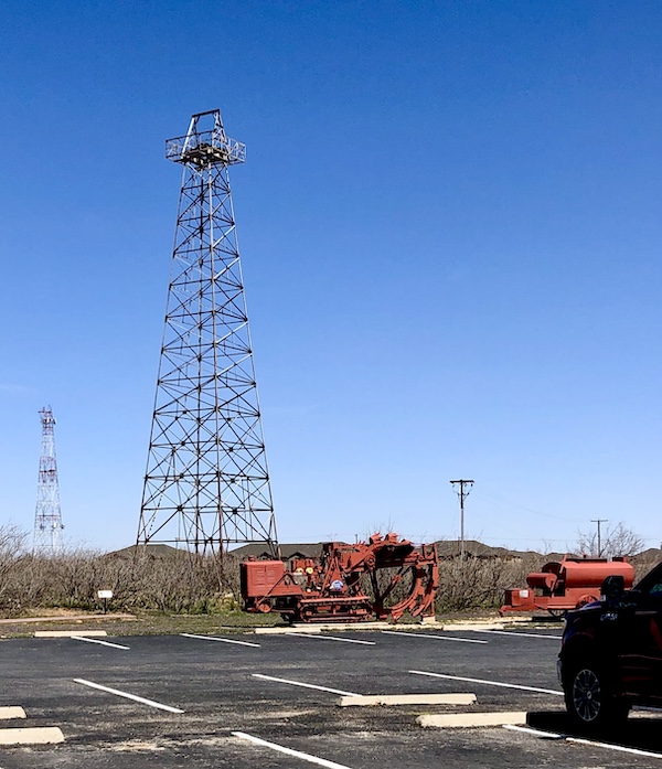 Very tall modern metal drilling rig on display at the Petroleum Museum Midland Texas