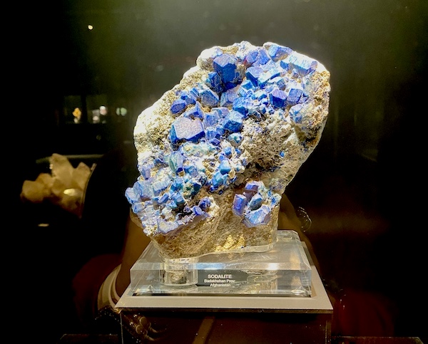 Large rock with big chunks of blue sodalite mineral on display at the Petroleum Museum Midland Texas