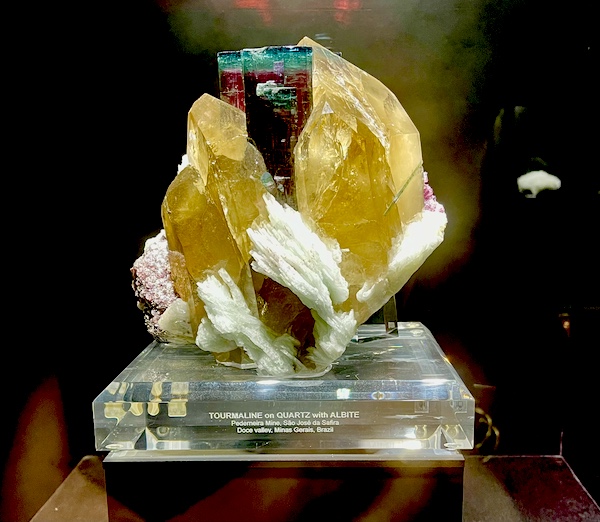 Gold, white, burgundy and turquoise minerals on display at the Petroleum Museum Midland Texas