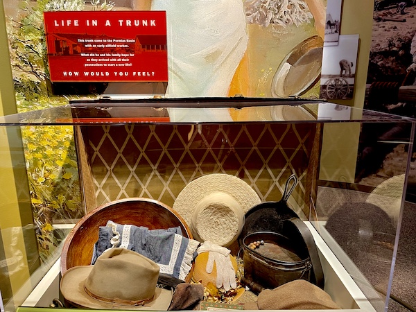 Old trunk containing family clothing and other items on display at the Petroleum Museum Midland Texas