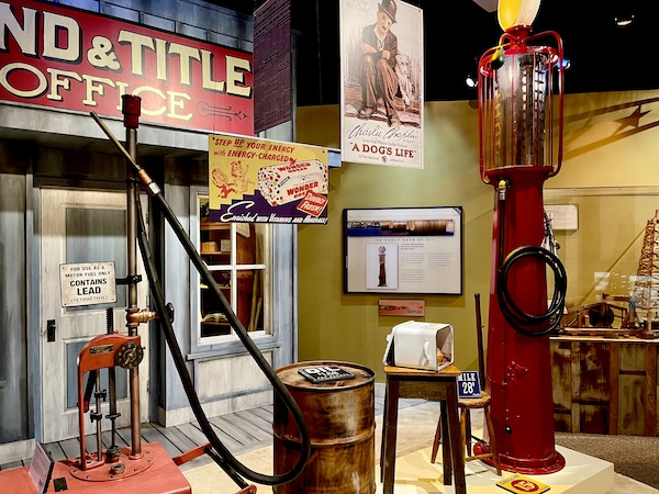 Antique gas pump and replica of the Land and Title Office on display at the Petroleum Museum Midland Texas