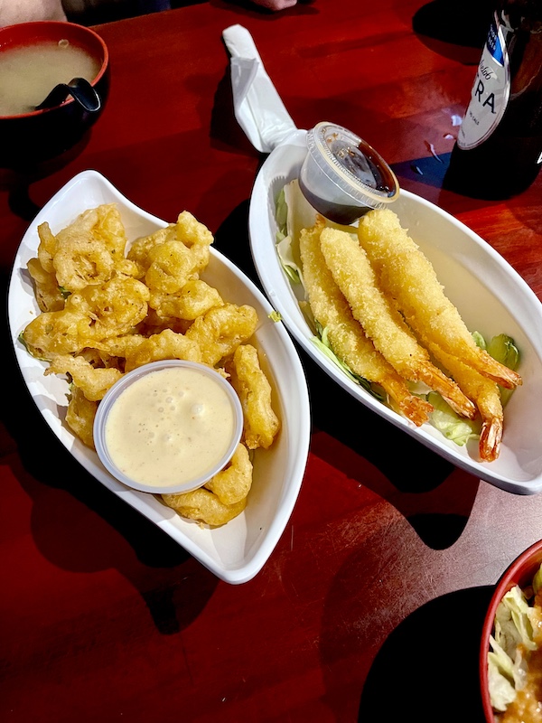 White dishes containing fried calamari and tempura shrimp from Sakura Sushi Sulphur Springs TX