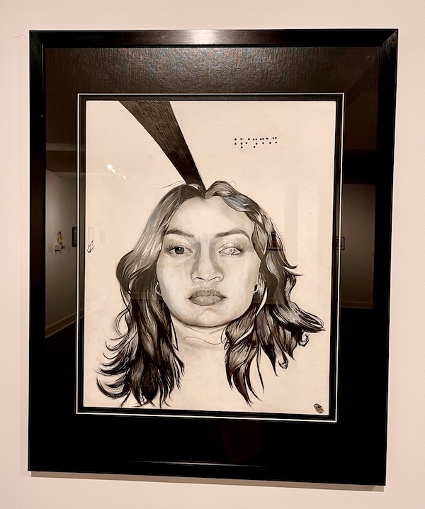 Emotional monochrome painting of a girl with a blind eye on display at The Grace Museum Abilene TX