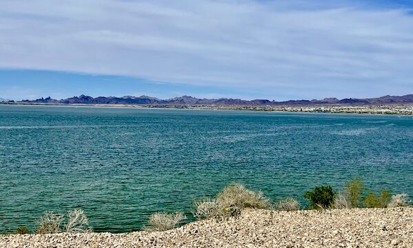 Gorgeous green lake surrounded by desert and mountains during our visit to Beautiful Lake Havasu Arizona