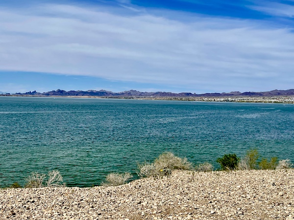 Gorgeous green lake surrounded by desert and mountains during our visit to Beautiful Lake Havasu Arizona