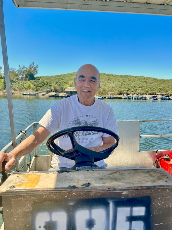 Steve steering our rental pontoon boat in Lake Skinner Temecula CA