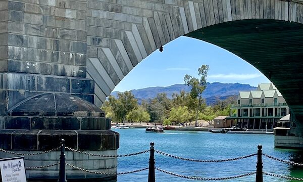 London Bridge Lake Havasu AZ with mountains visible through a bridge arch.