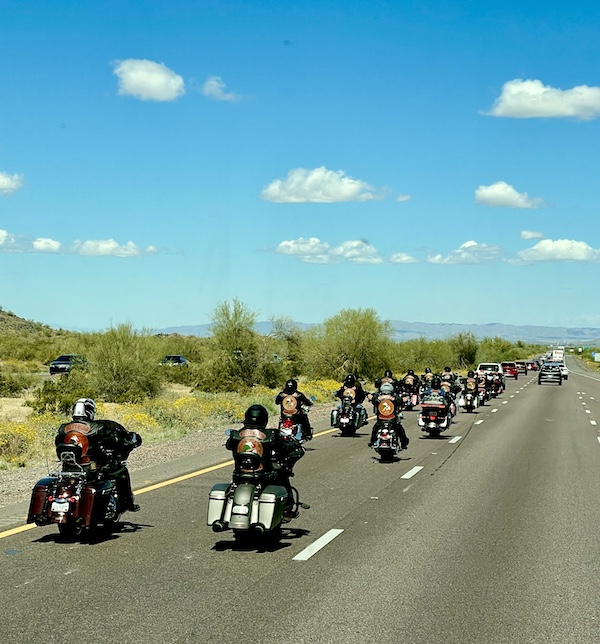 Highway with pairs of motorcyclists riding down the road on Our Visit to Quartzite Arizona