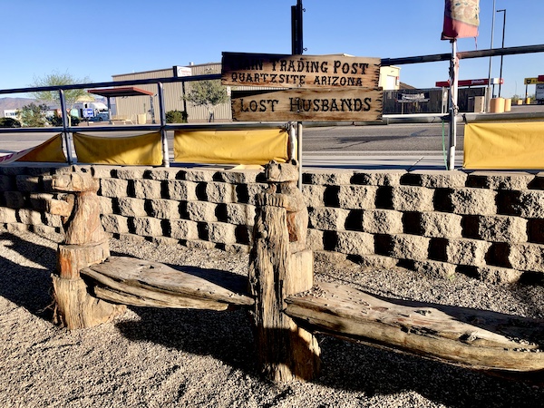 Wood deck and wall with sign for Main Trading Post seen on Our Visit to Quartzite Arizona