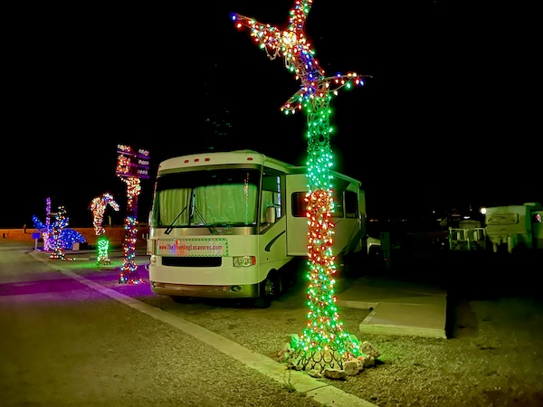 RV parked between colorful lit sculptures during Our Visit to Quartzite Arizona