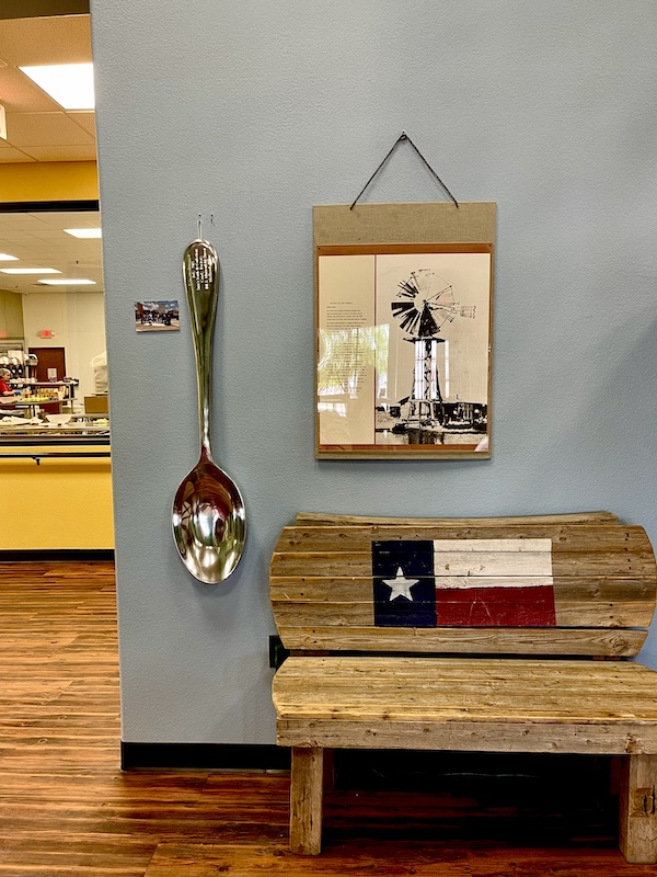 Giant silver spoon and other items of decor at Susie's South Forty Midland TX