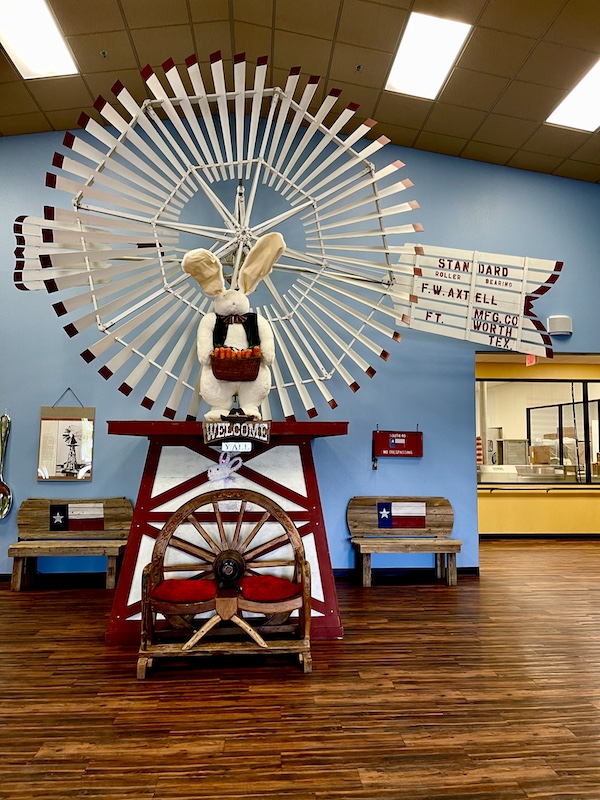 Windmill with a big stuffed bunny at Susie's South Forty Midland TX