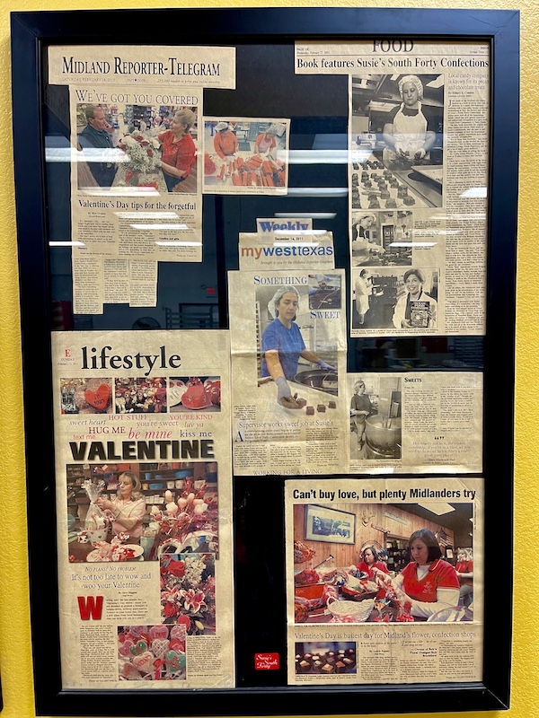 Cork board with newspaper clippings at Susie's South Forty Midland TX