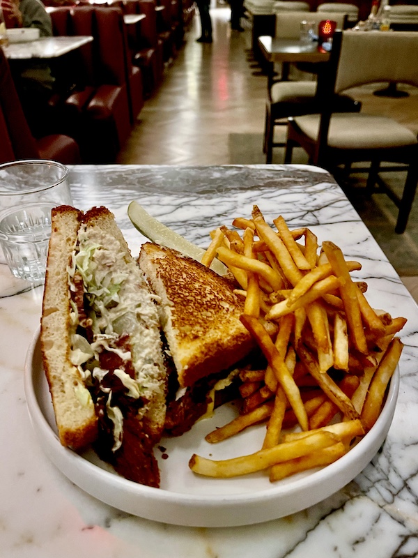 Tuna sandwich half turned up to show filling inside at Moonlark's Dinette The Hoxton LA