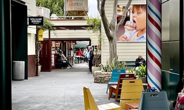Colorful tables and chairs and additional stores at the Original Farmers Market L.A.