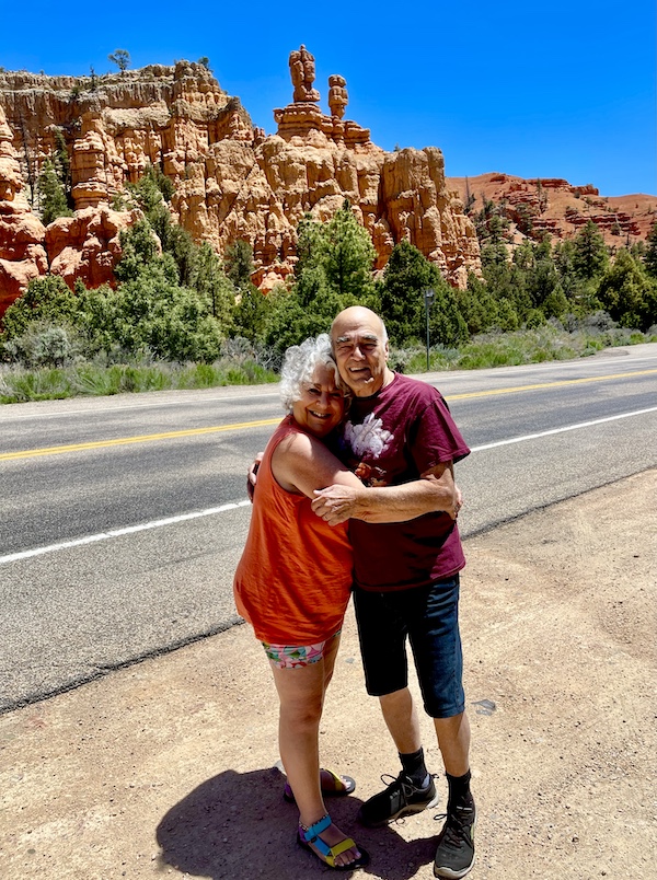 Steve and I holding each other in front of red rock formations at Bryce Canyon National Park