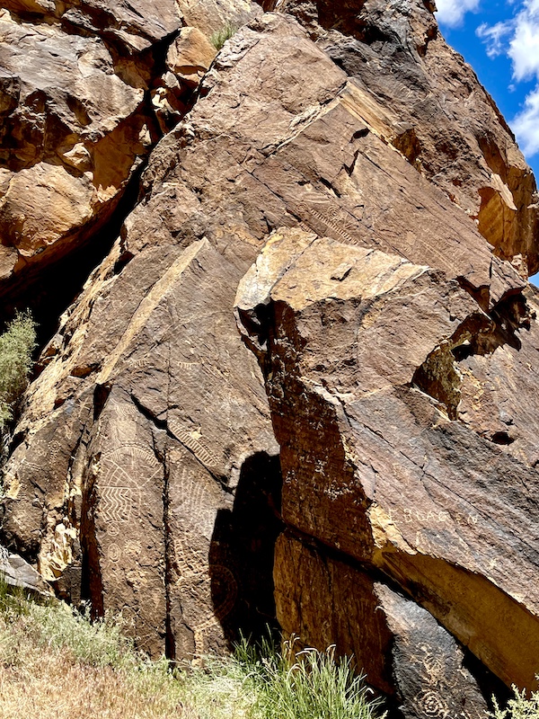 Flat surfaces of rocks chiseled with designs at Petroglyphs of Parowan Gap Utah