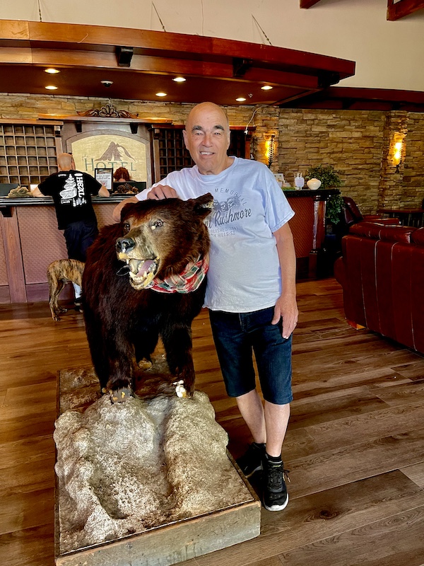 Steve standing by a taxidermy bear during our day at Scenic Mount Charleston Nevada
