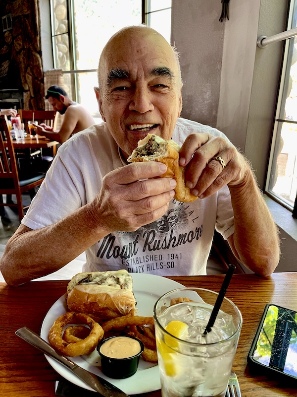 Steve trying to take a bite of his huge Philly Cheesesteak at lunch on scenic Mount Charleston