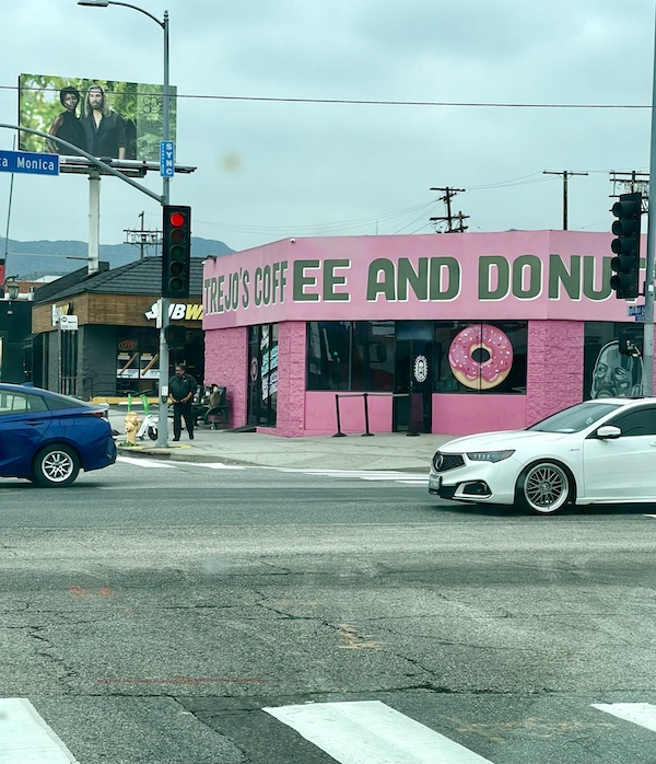 Pink building is a coffee and donut shop owned by Danny Trejo of Trejo's Tacos Hecho en Los Angeles