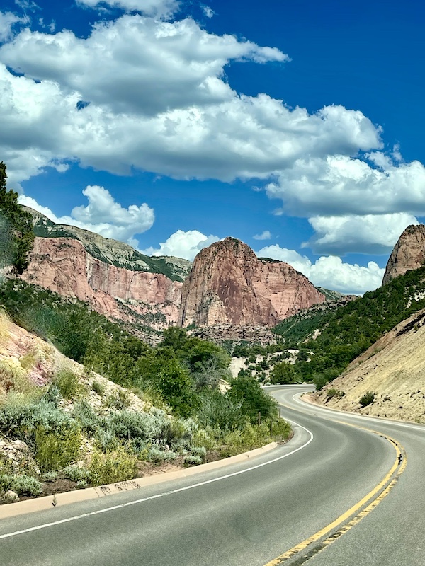 Red rock peaks along a curvy mountain road at Zion National Park Kolob Canyons