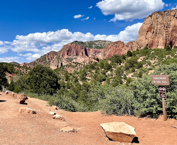 Multiple red rock peaks along a hiking trail at Zion National Park Kolob Canyons
