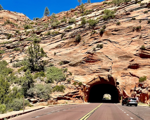 Narrow and low tunnel through a mountain at Zion National Park Utah