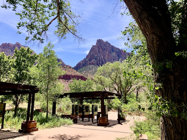 Information, trees, shade and mountains at the visitors center at Zion National Park Utah