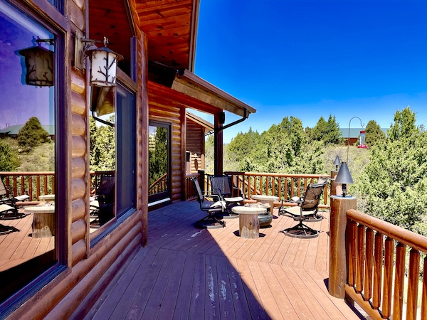 Wood deck off a log home with amazing view of mountains and trees near Delightful Parowań Utah