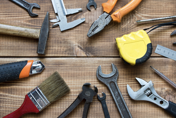 Wood table with assorted tools celebrating Happy Labor Day 2024