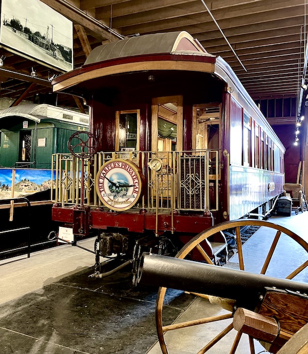 Dark red narrow gauge private railcar.