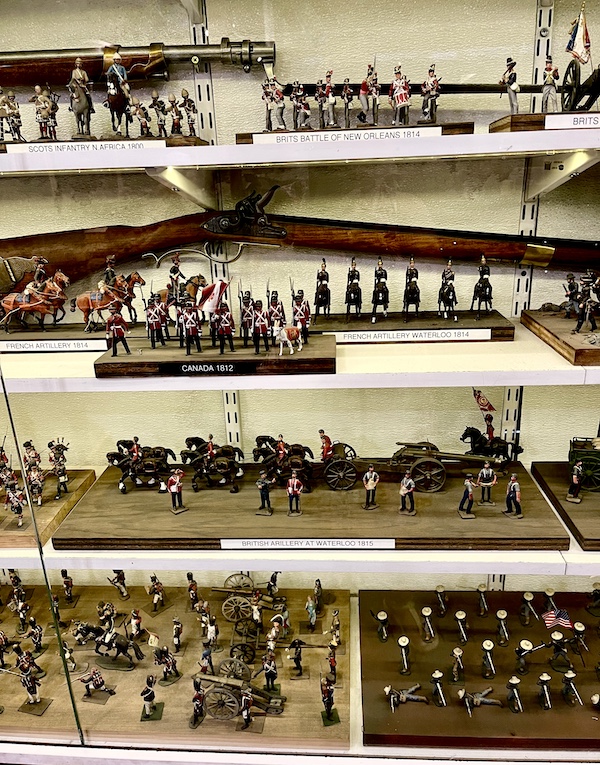 Display case with lots of tin soldiers.