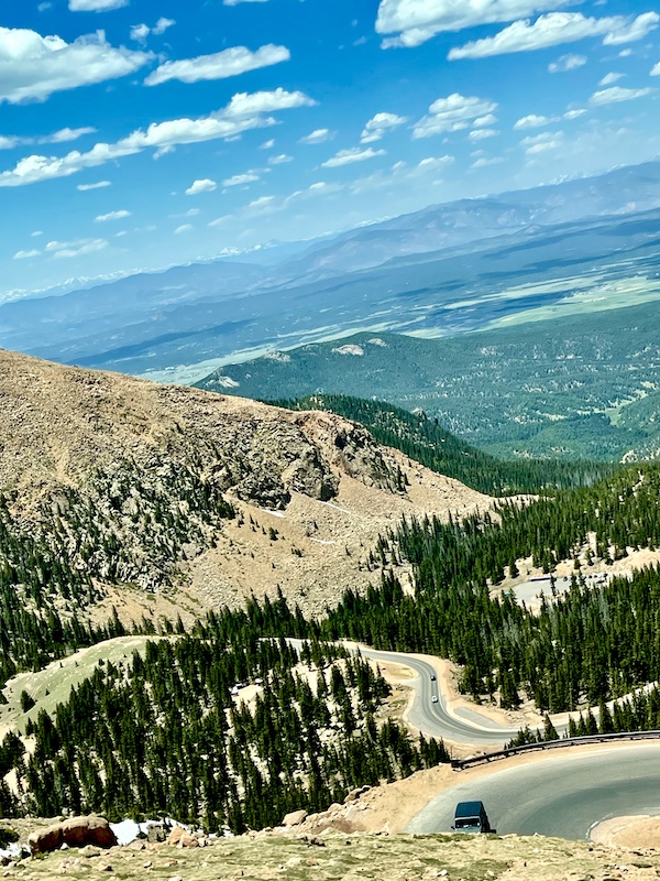 Skyline with mountains and highways showing steep incline of road up Pikes Peak in Colorado