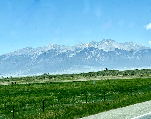 On the way to Pikes Peak in Colorado we passed a snow capped mountain range with a meadow in the foreground