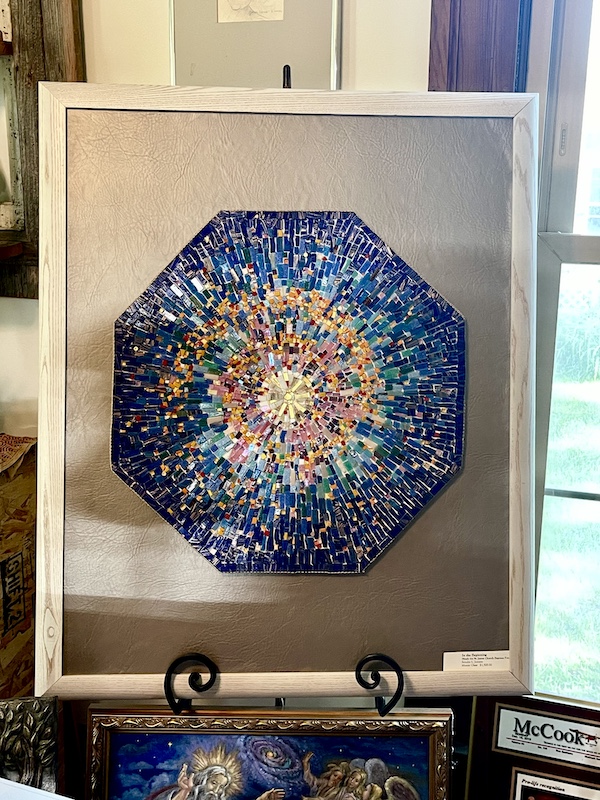 Colorful octagonal mosaic mounted in a beige frame. Created by Artist Sondra Jonson Cambridge NE