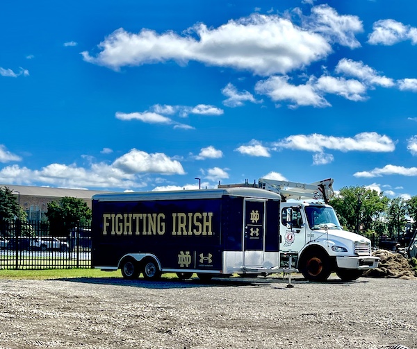 Large blue equipment trailer for the Fighting Irish of Notre Dame.