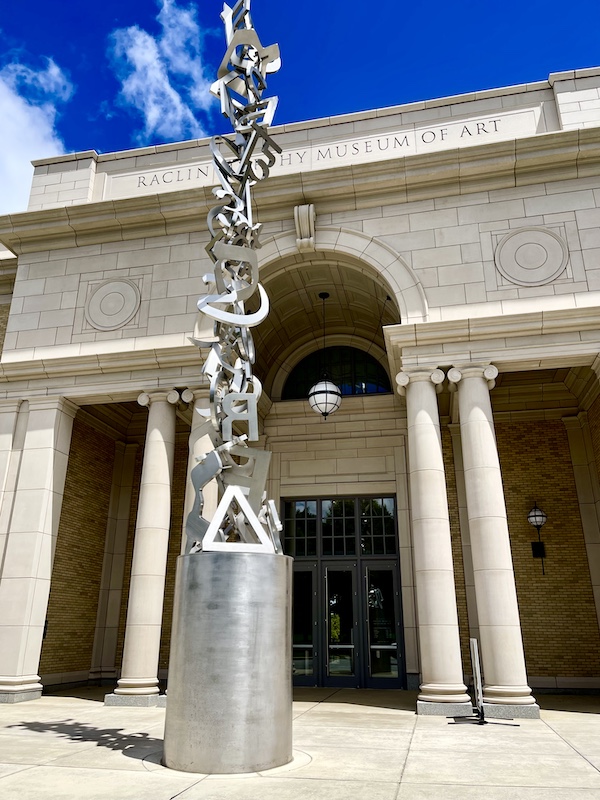 White building with columns and metal sculpture in front is an art museum at Notre Dame