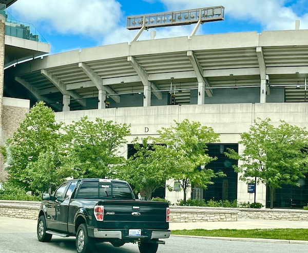 Football stadium with trees in front and a pick up truck was part of our Fun Time at Notre Dame